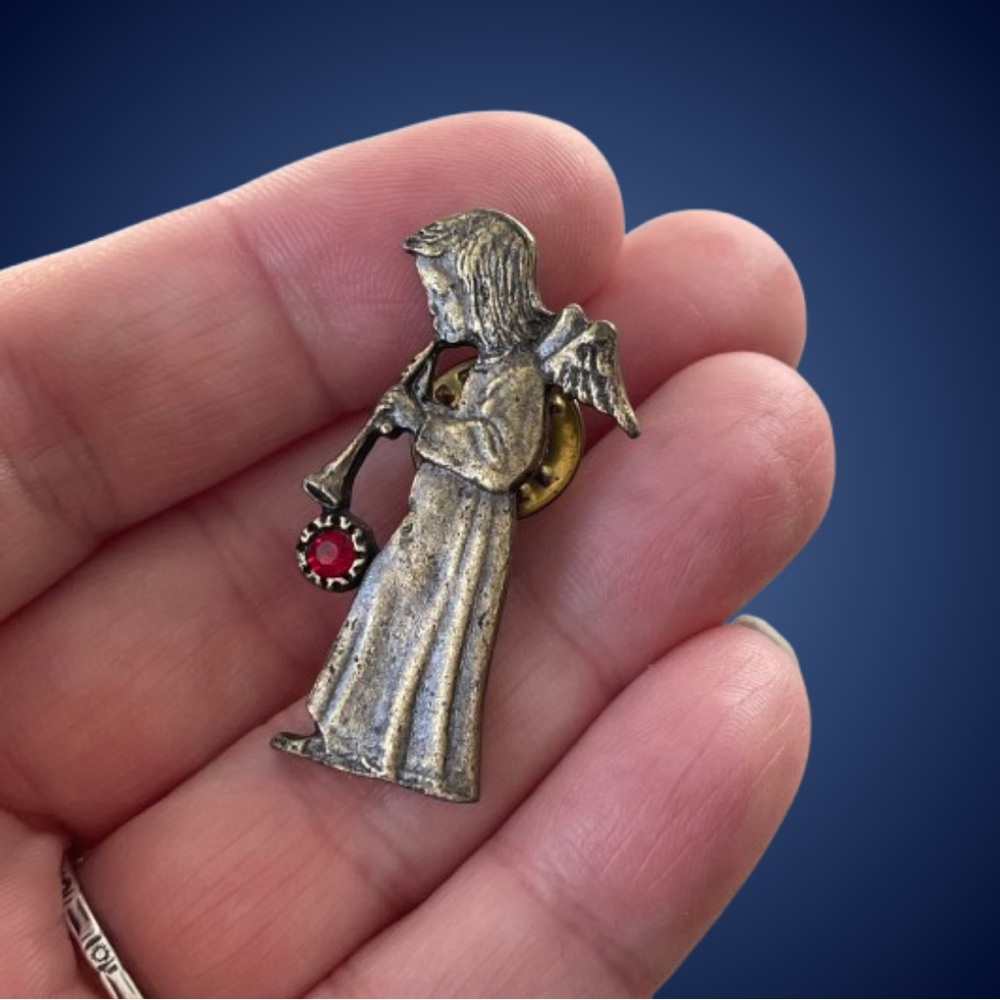 Vintage brass/bronzetone angel lapel pin red rhinestone instrument festive Xmas
